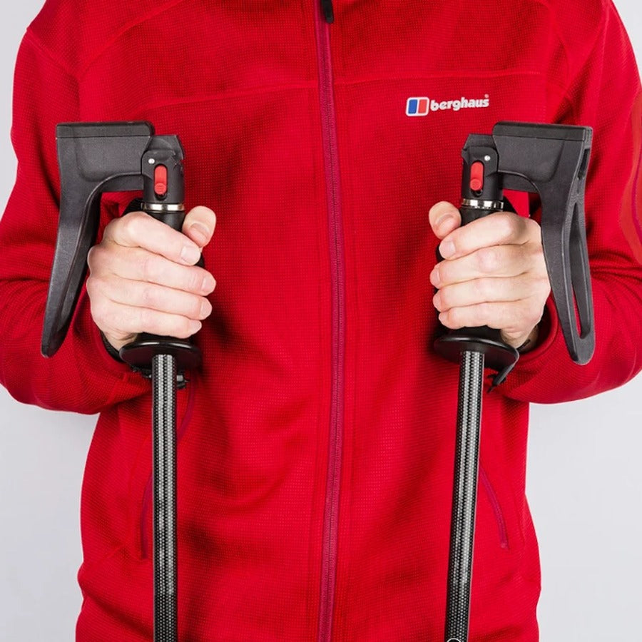 Gripping the SeatStix handles, red jacket