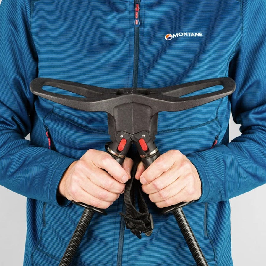 Gripping the SeatStix handles, blue jacket